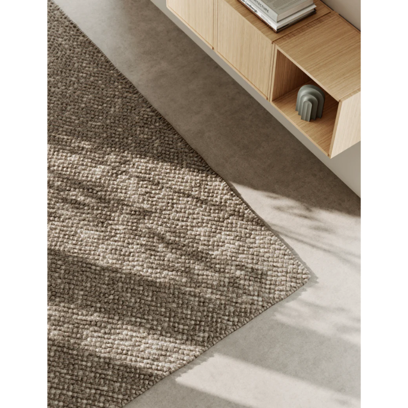 A Tact Rug from Woud in a family room.