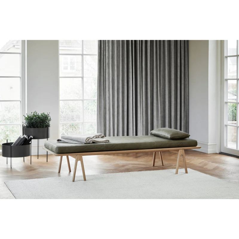 A Tact Rug from Woud in a sunroom.
