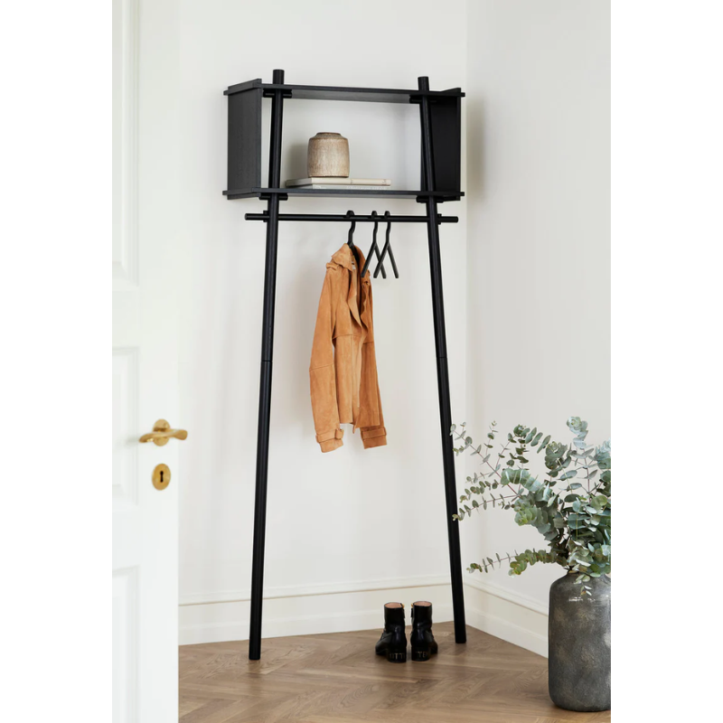The Töjbox Wardrobe in Black being used as a clothes rack.