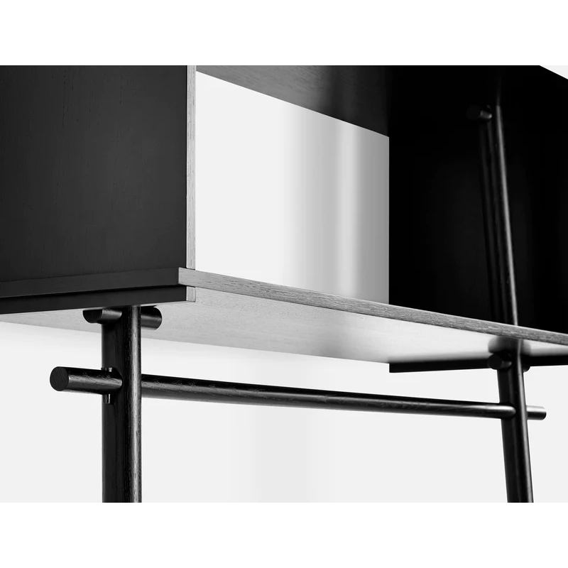 A close up shot of Töjbox Wardrobe from Woud in black.