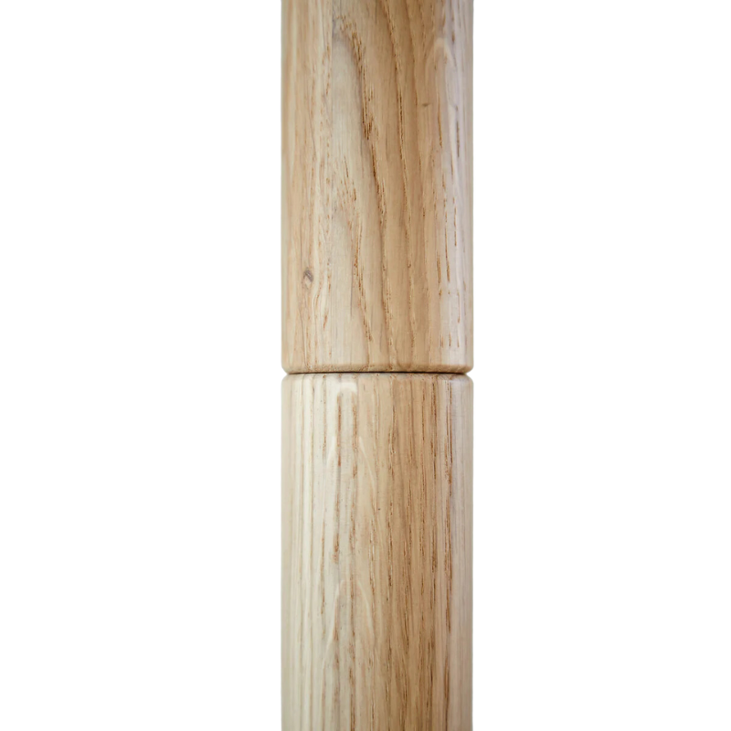A picture showing the quality of the Töjbox Wardrobe from Woud in white pigmented oak color.