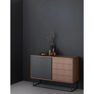 The Virka Sideboard (high) from Woud in a dark bedroom setting.