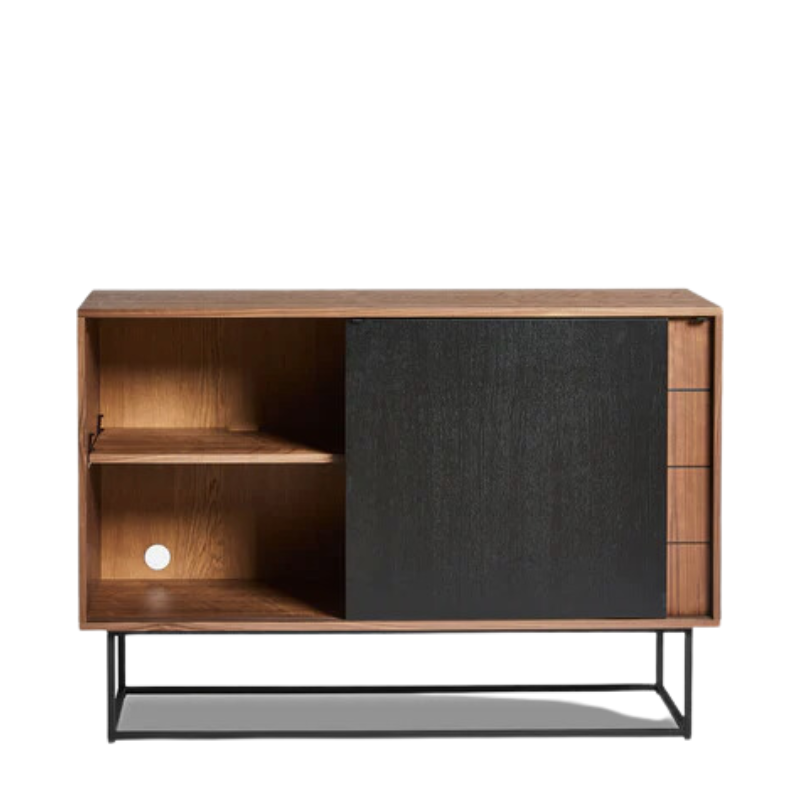 The Virka Sideboard (high) from Woud in walnut and black depicted with the sliding door opened revealing the inner shelf.