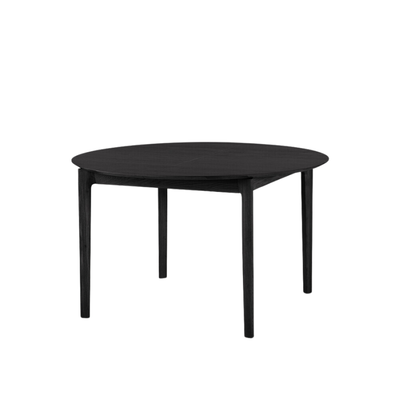 The Round Bok Extendable Dining Table from Ethnicraft in solid oak, tainted black.
