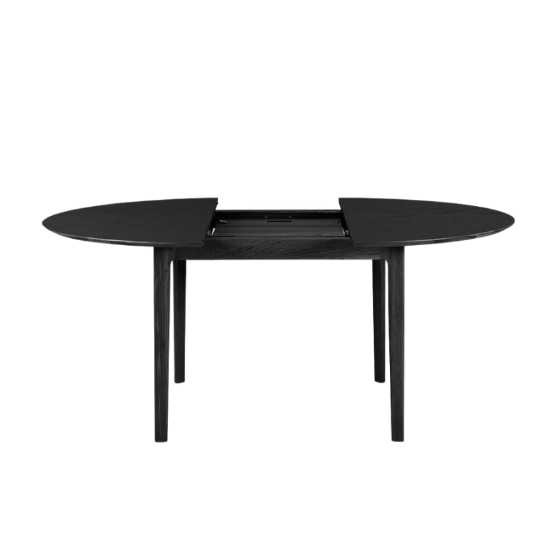 The Round Bok Extendable Dining Table from Ethnicraft in solid oak, tainted black.