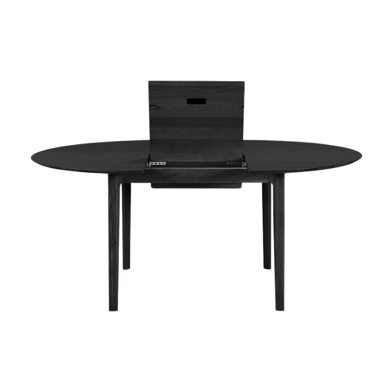 The Round Bok Extendable Dining Table from Ethnicraft in solid oak, tainted black.