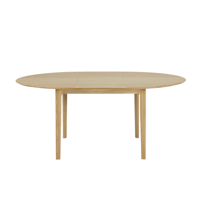 The Round Bok Extendable Dining Table from Ethnicraft in solid oak.