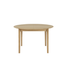 The Round Bok Extendable Dining Table from Ethnicraft in solid oak.