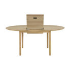 The Round Bok Extendable Dining Table from Ethnicraft in solid oak.