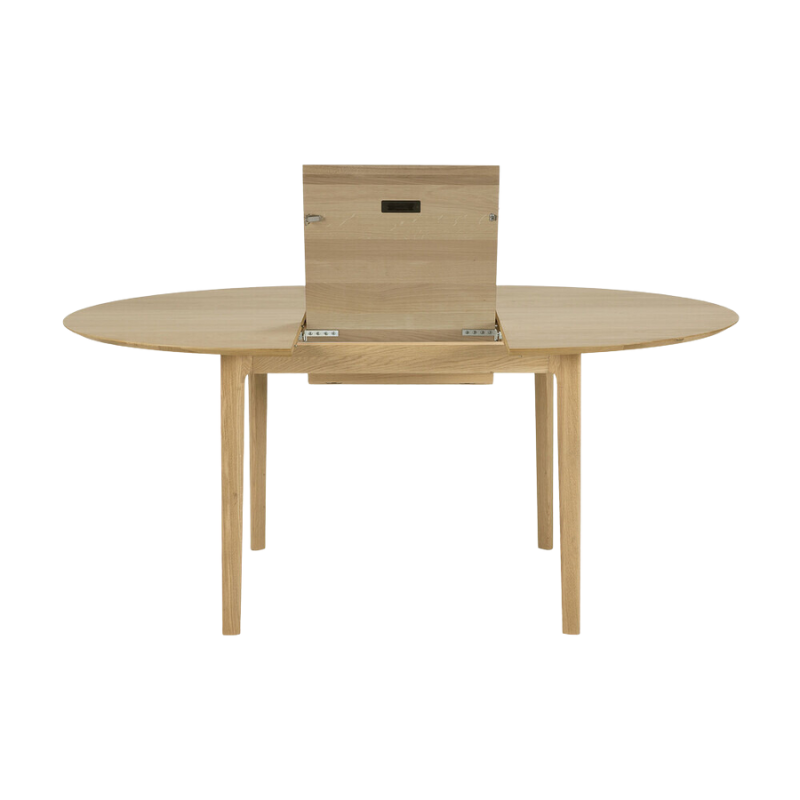 The Round Bok Extendable Dining Table from Ethnicraft in solid oak.