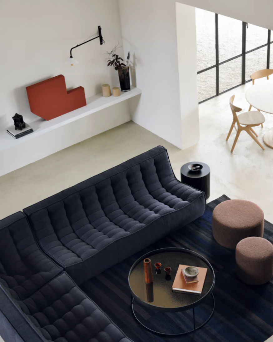 A living room lifestyle shot featuring the N701 Sofa from Ethnicraft, sold at Illuminee. Make your living room more comfortable today, and shop our living room collection.
