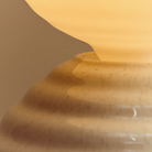 Detail of the pebble white ceramic base  Wake Sleep Light by Tala Lighting.