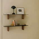 &Tradition VP9 Flowerpot Portable Table Lamp in matte black on wall shelf.