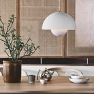 The Flowerpot VP7 Pendant from &Tradition in white over a dining table.