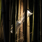 The Come Together Portable Lamp from Artemide in aluminum outdoors.