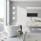 The Dioscuri Wall / Ceiling Light from Artemide in the size medium in a bathroom.