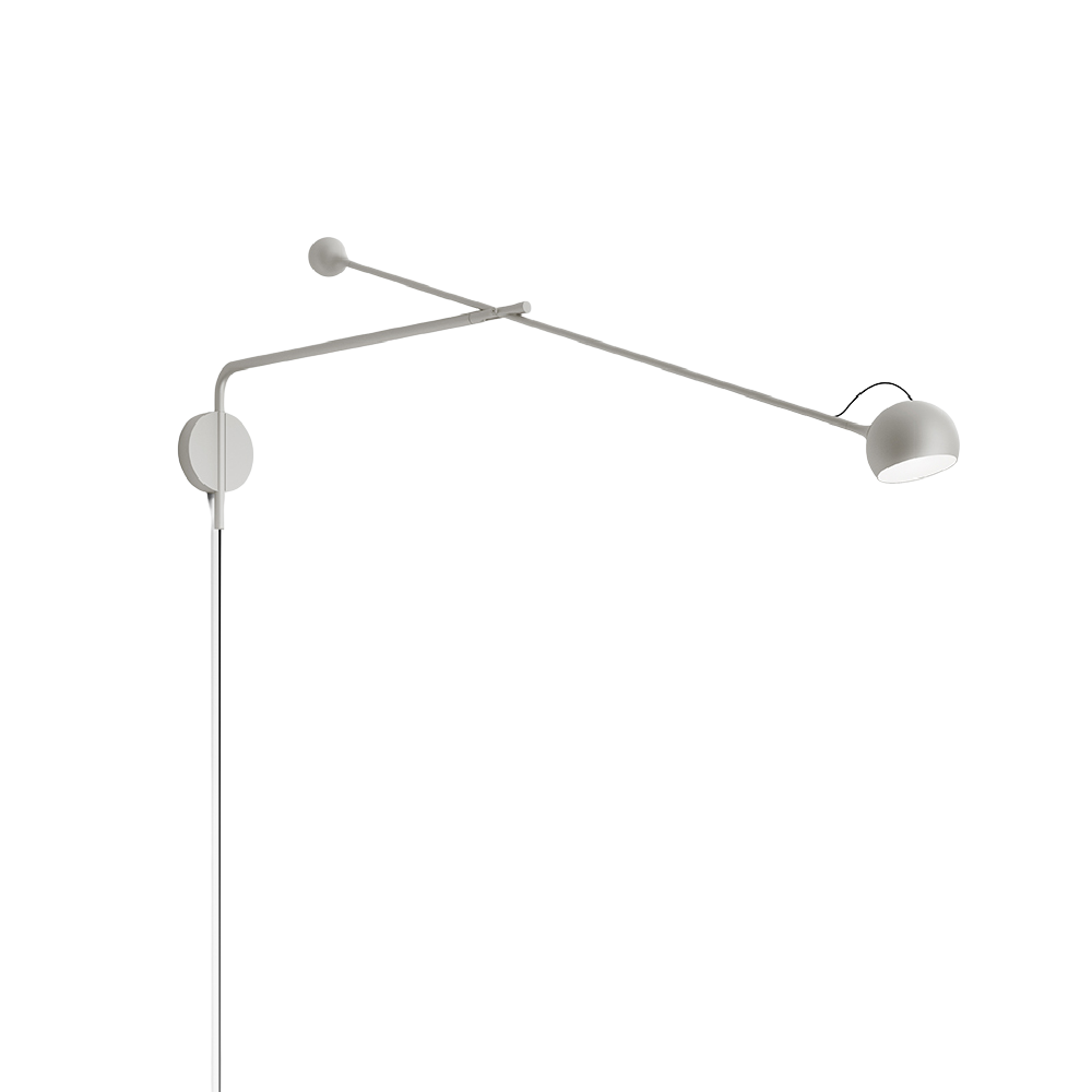 The white Ixa Arm Plug In Wall Sconce from Artemide.