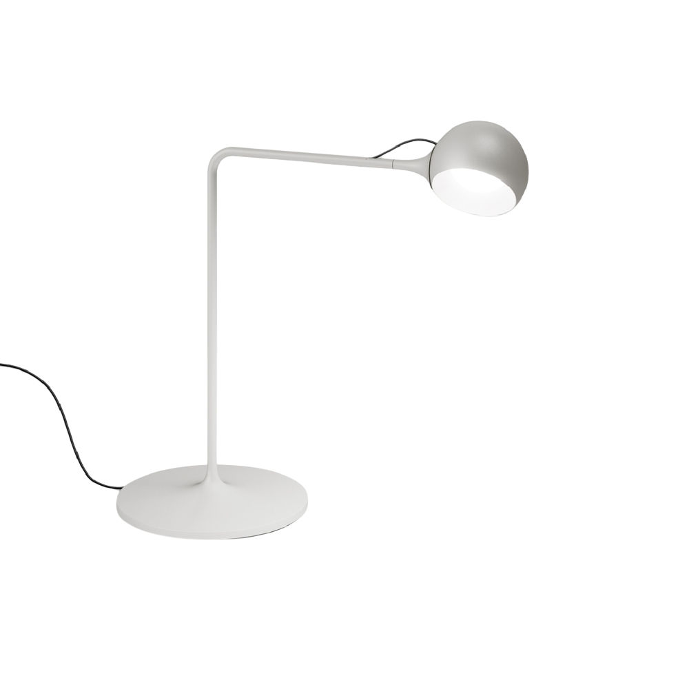 The white Ixa Table Lamp from Artemide.