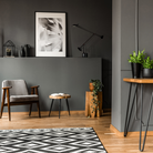 The Tizio Classic Task Lamp from Artemide in black in a living room.