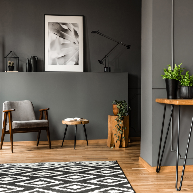 The Tizio Classic Task Lamp from Artemide in black in a living room.