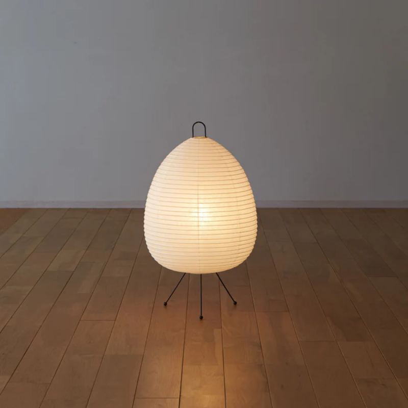 The Asano Donguri Lamp A120 turned on in a living room.