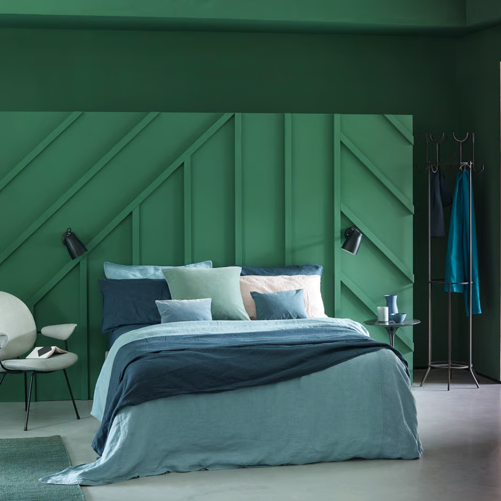 The Atelier Wall Sconce from Astro Lighting in a guest bedroom.