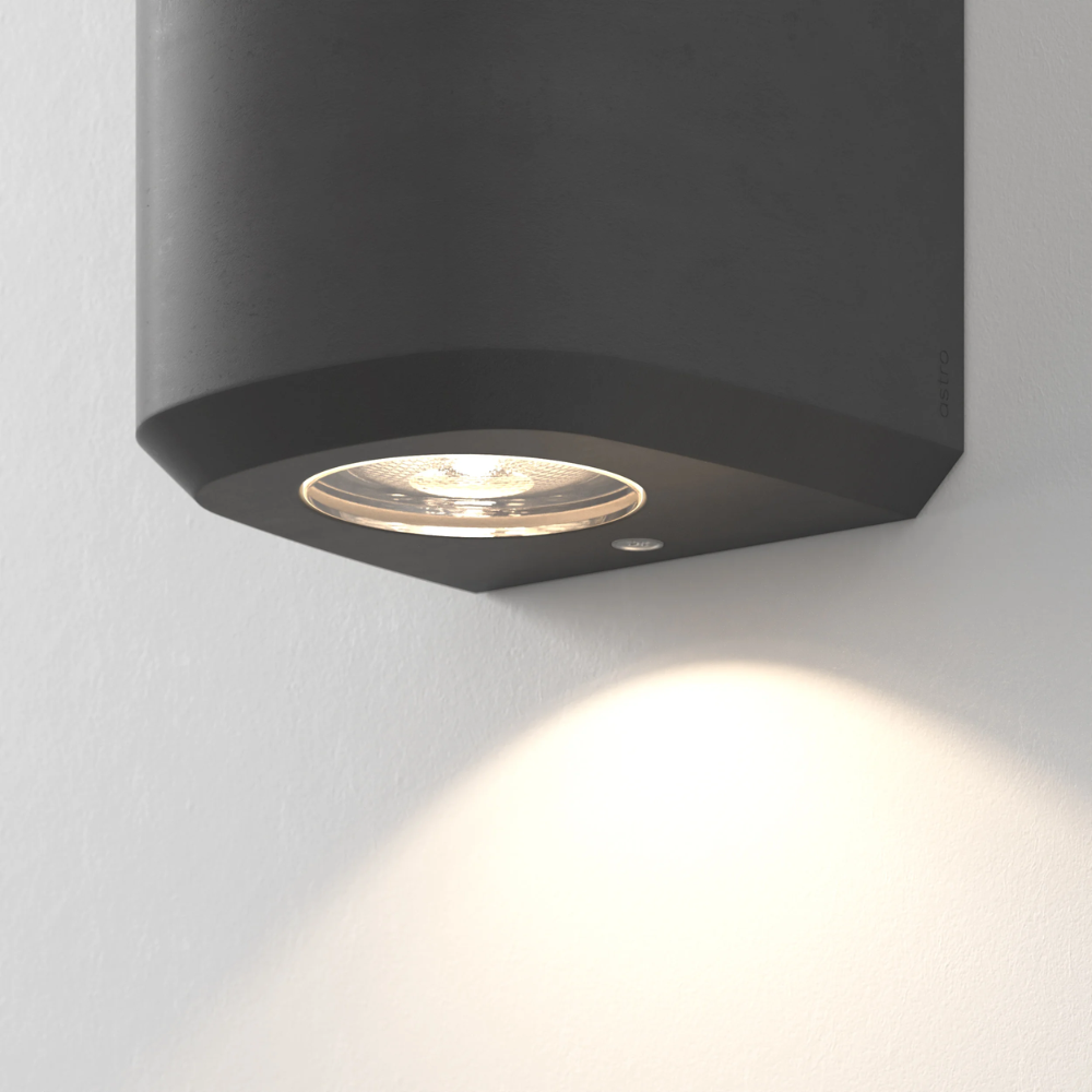 Close up of the light source of the Brixham Wall Single outdoor sconce in charcoal concrete by Astro Lighting.
