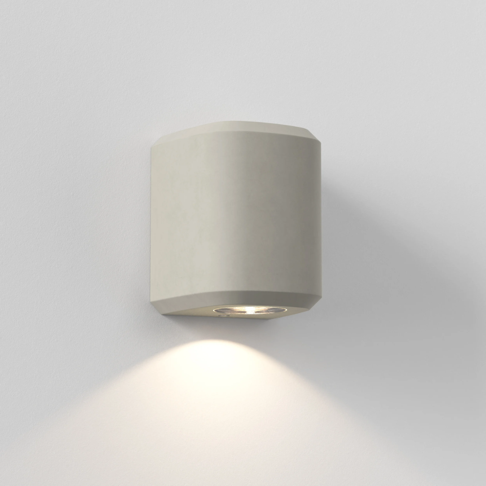 The Brixham Wall Single outdoor sconce in grey concrete by Astro Lighting at an angle.