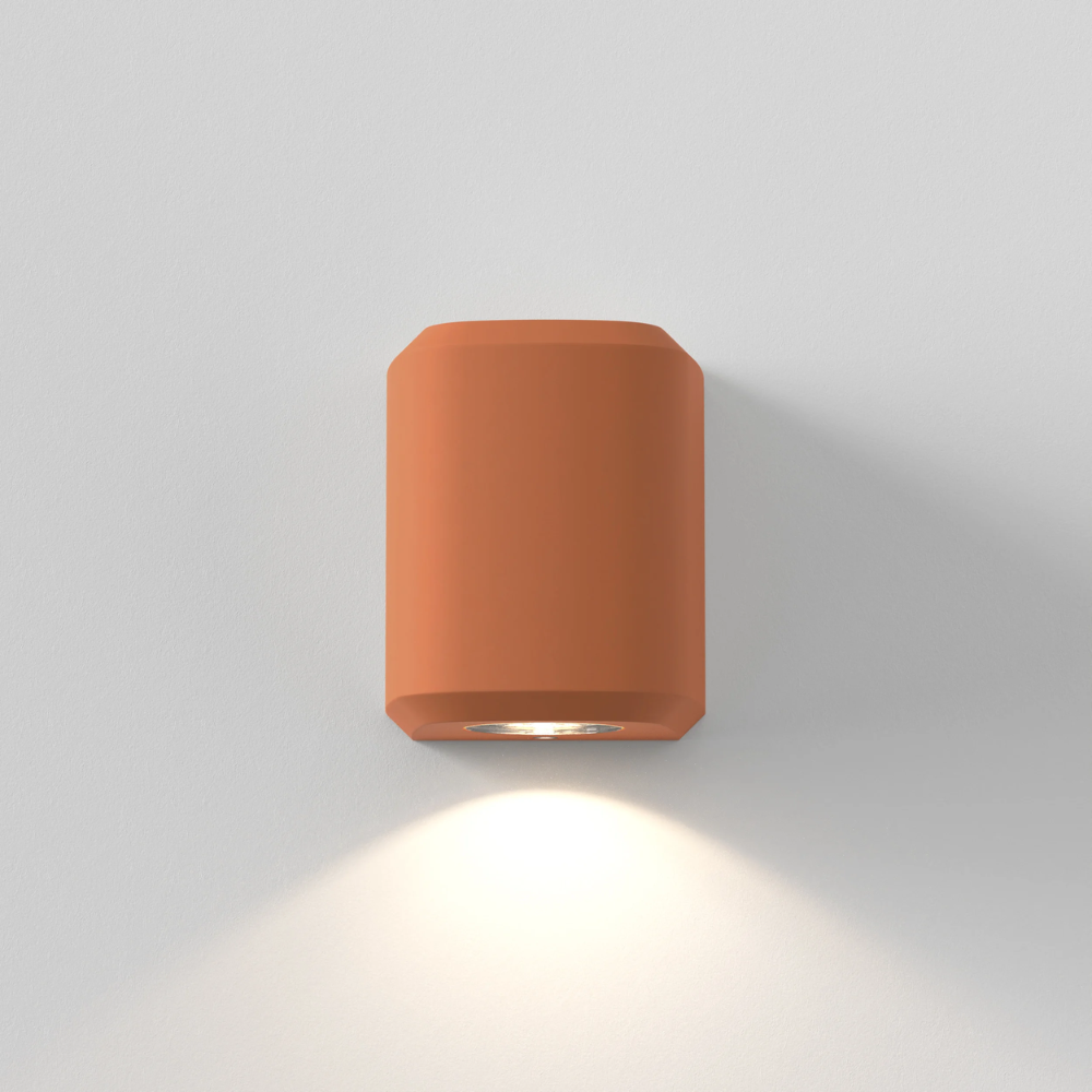 The Brixham Wall Single outdoor sconce in terracotta concrete by Astro Lighting front view.