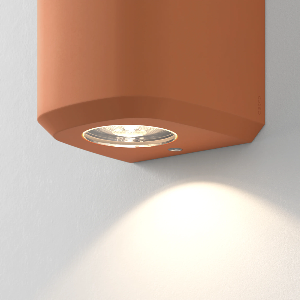 Close up of the light source of the Brixham Wall Single outdoor sconce in terracotta concrete by Astro Lighting.