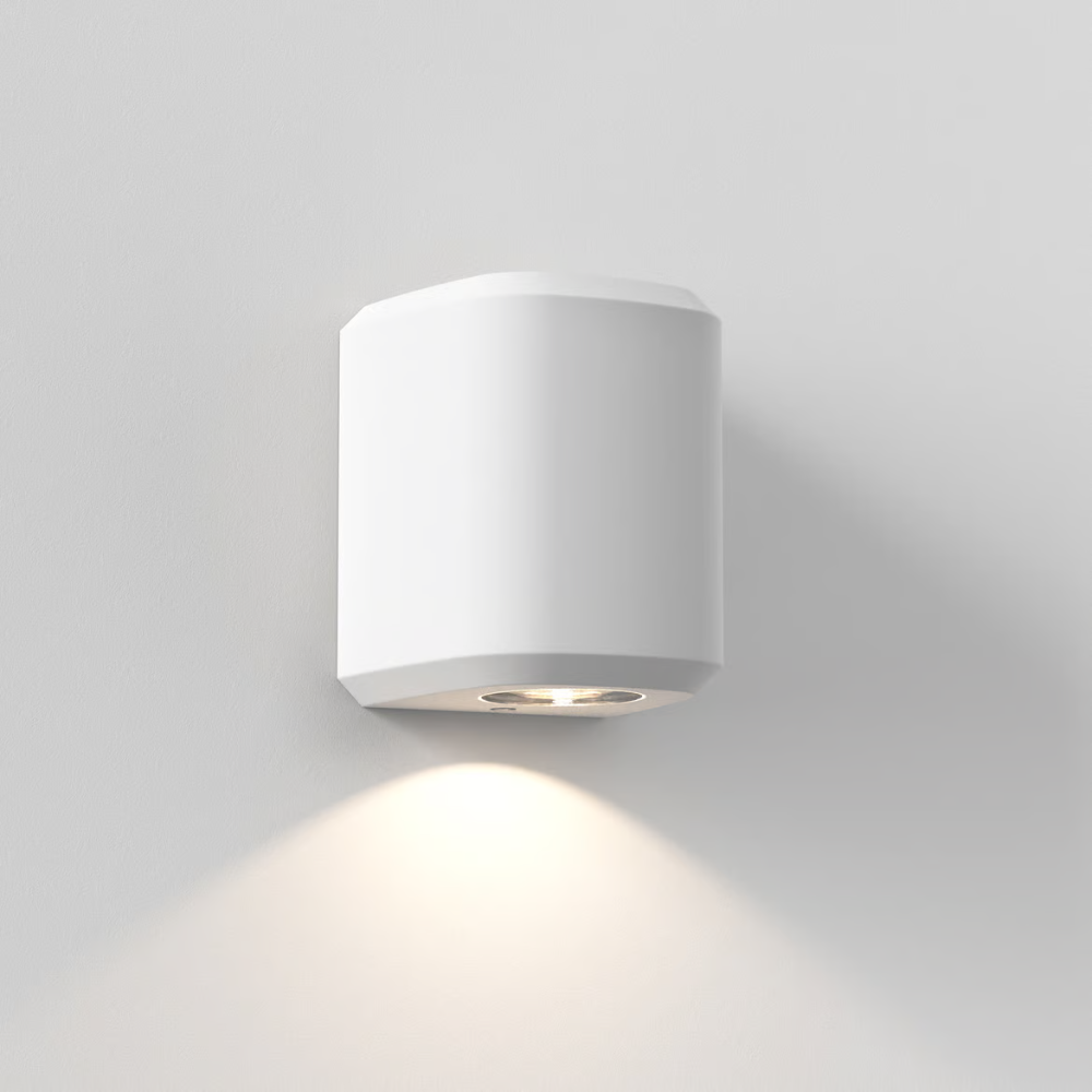 The Brixham Wall Single outdoor sconce in white concrete by Astro Lighting from an angle.