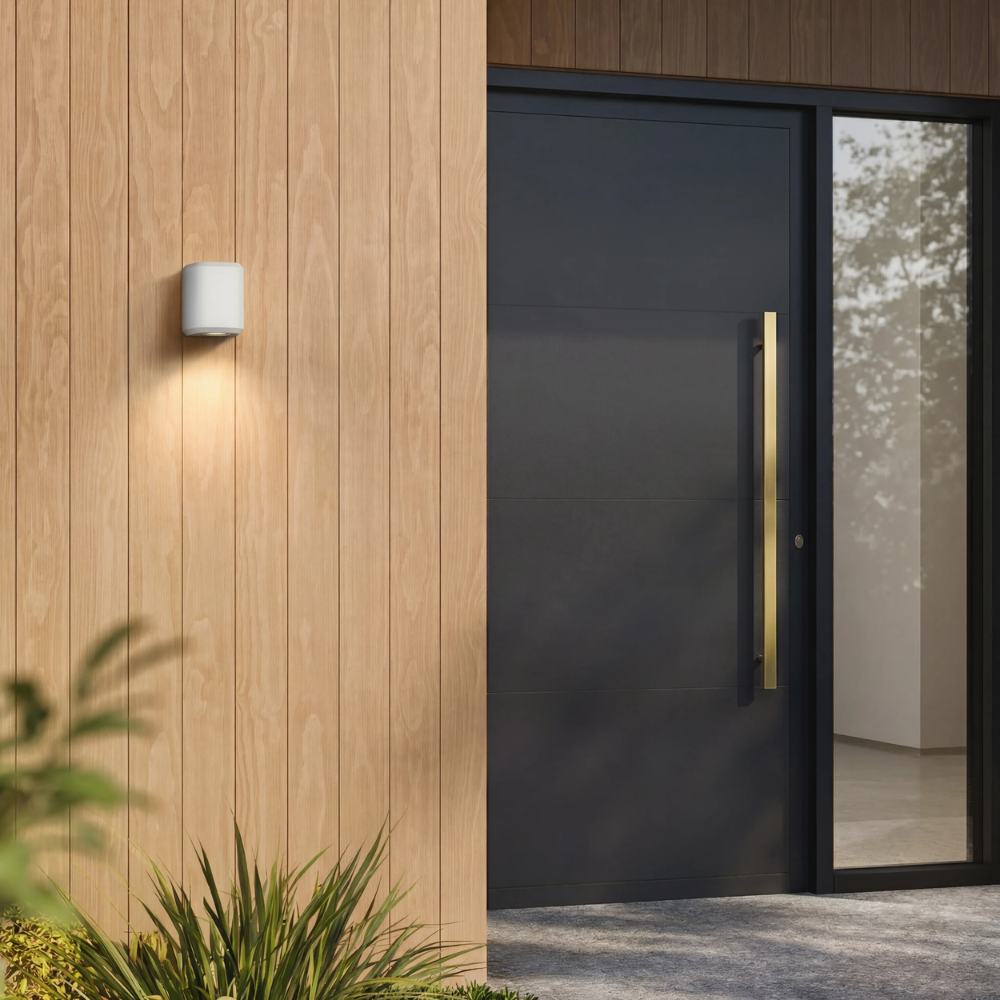 Brixham Wall Single outdoor sconce in white concrete by Astro Lighting installed outside during the day.