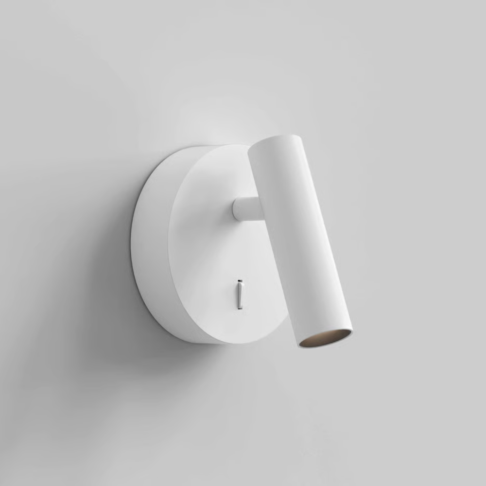 The matte white Enna Surface Round Wall Sconce from Astro Lighting in a studio.