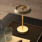The Halo Portable Lamp from Astro Lighting in light bronze in a lounge.