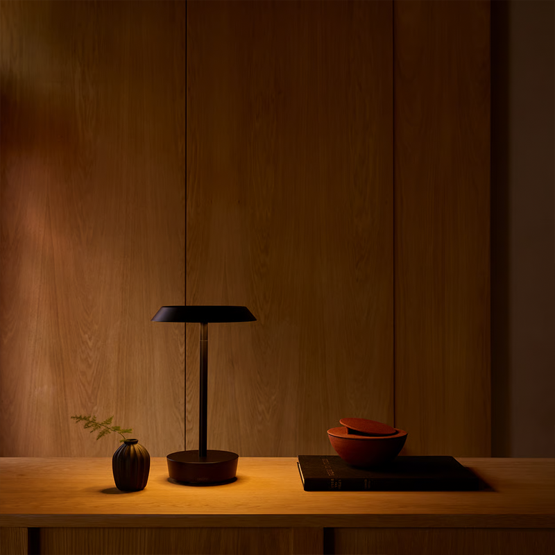 The Halo Portable Lamp from Astro Lighting in matt black in a guest bedroom.