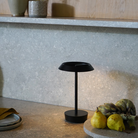 The Halo Portable Lamp from Astro Lighting in matt black in a kitchen.