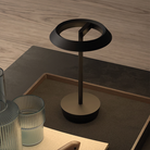 The Halo Portable Lamp from Astro Lighting in matt black in a lounge.