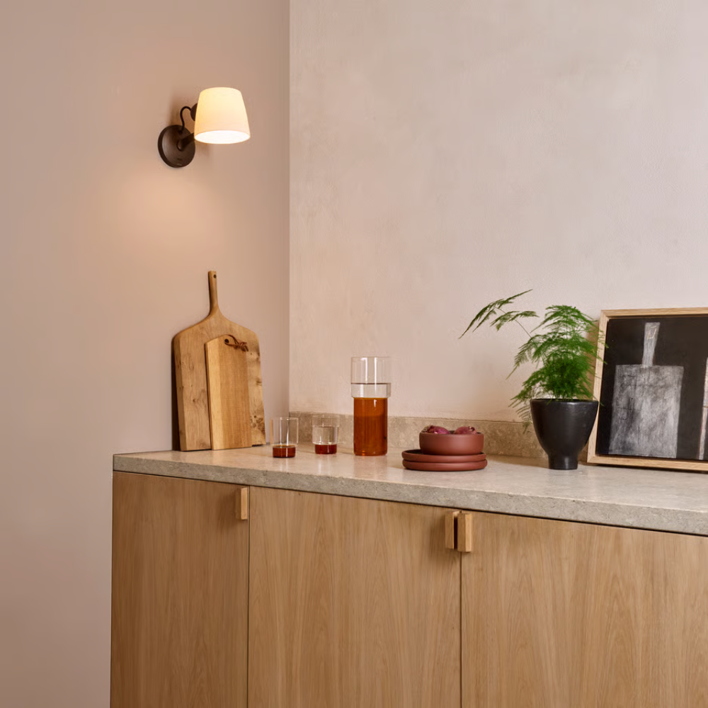 The bronze Imari Adjustable Wall Sconce from Astro Lighting in a family area.