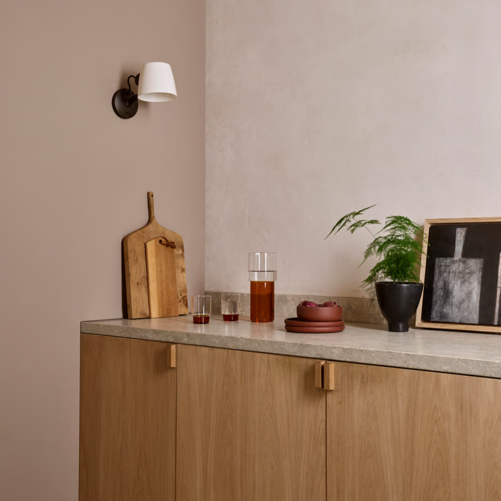 The bronze Imari Adjustable Wall Sconce from Astro Lighting in a kitchen and dining space.