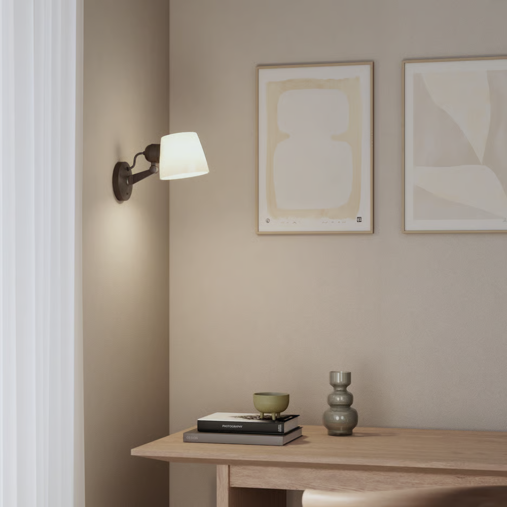 The bronze Imari Adjustable Wall Sconce from Astro Lighting in a living space.