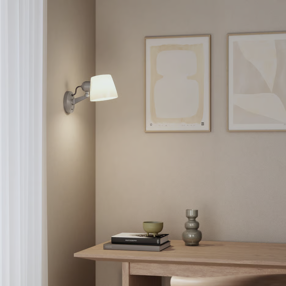 The matte nickel Imari Adjustable Wall Sconce from Astro Lighting in a home office.