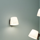 The Imari Wall Lamp from Astro Lighting in bronze in a living room.