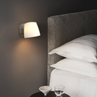 The Imari Wall Lamp from Astro Lighting in matt nickel in a primary bedroom.