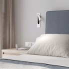 The matte white Keta Reading Light from Astro Lighting in a hotel room.
