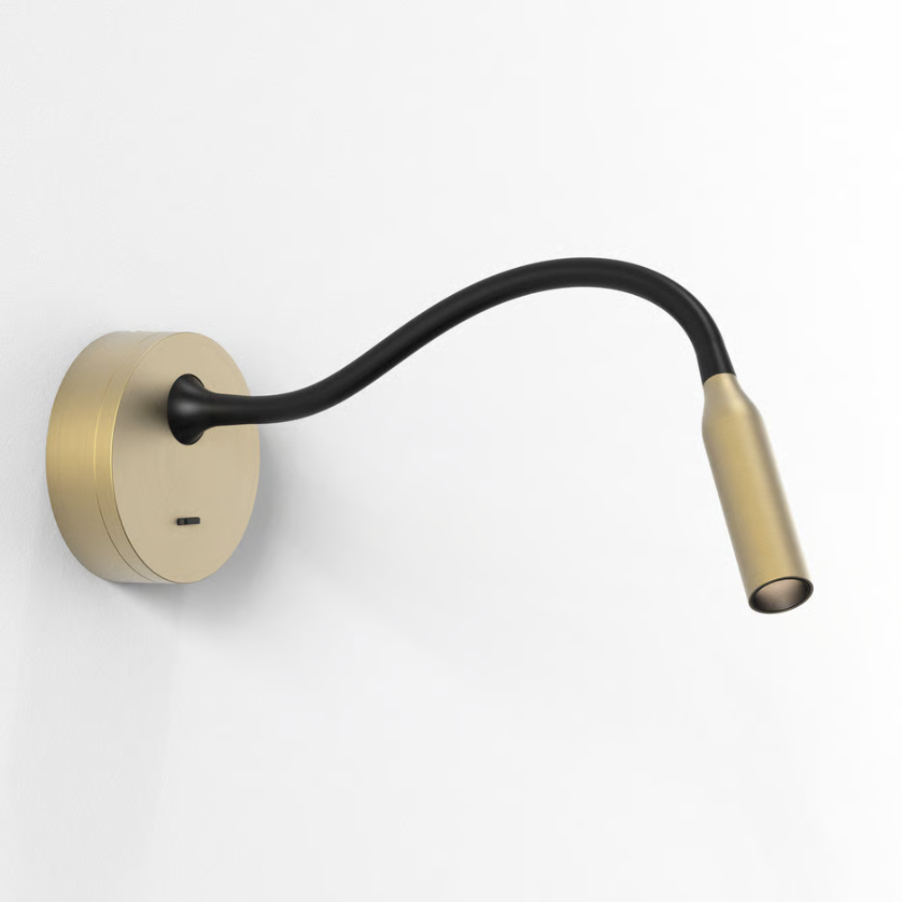The matte gold Lucca Surface Wall Sconce from Astro Lighting in a family area.