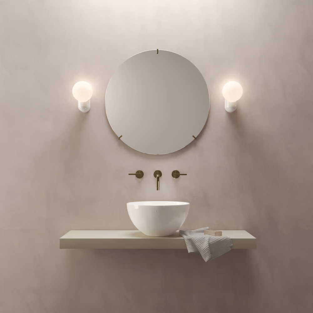 The Lyra Wall Sconce from Astro Lighting in an en suite bathroom.
