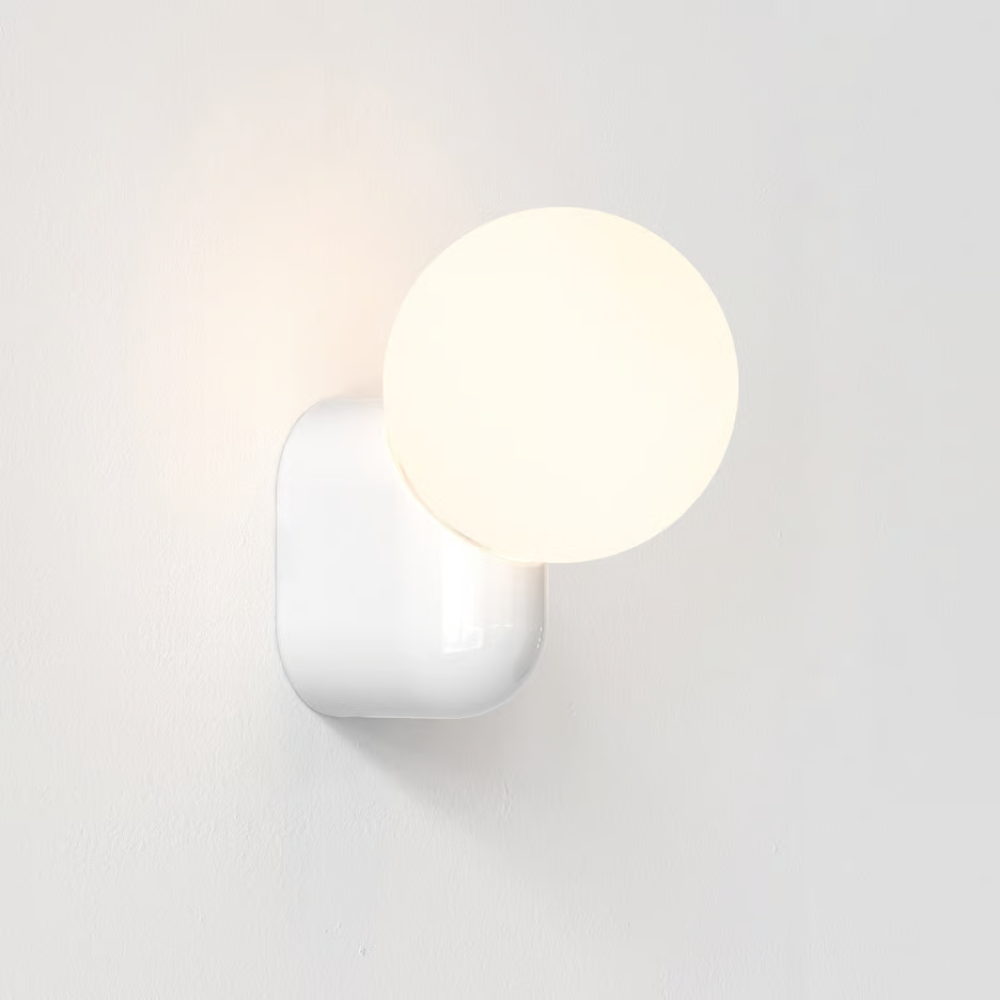 The Lyra Wall Sconce from Astro Lighting in a studio.