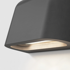 Light source of the Mast Twin Coastal Outdoor Wall Sconce by Astro Lighting in charcoal concrete. 