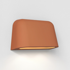 The Mast Twin Coastal Outdoor Wall Sconce by Astro Lighting in terracotta concrete.