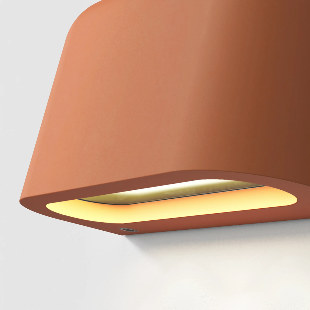 The light source of the Mast Twin Coastal Outdoor Wall Sconce by Astro Lighting in terracotta concrete.